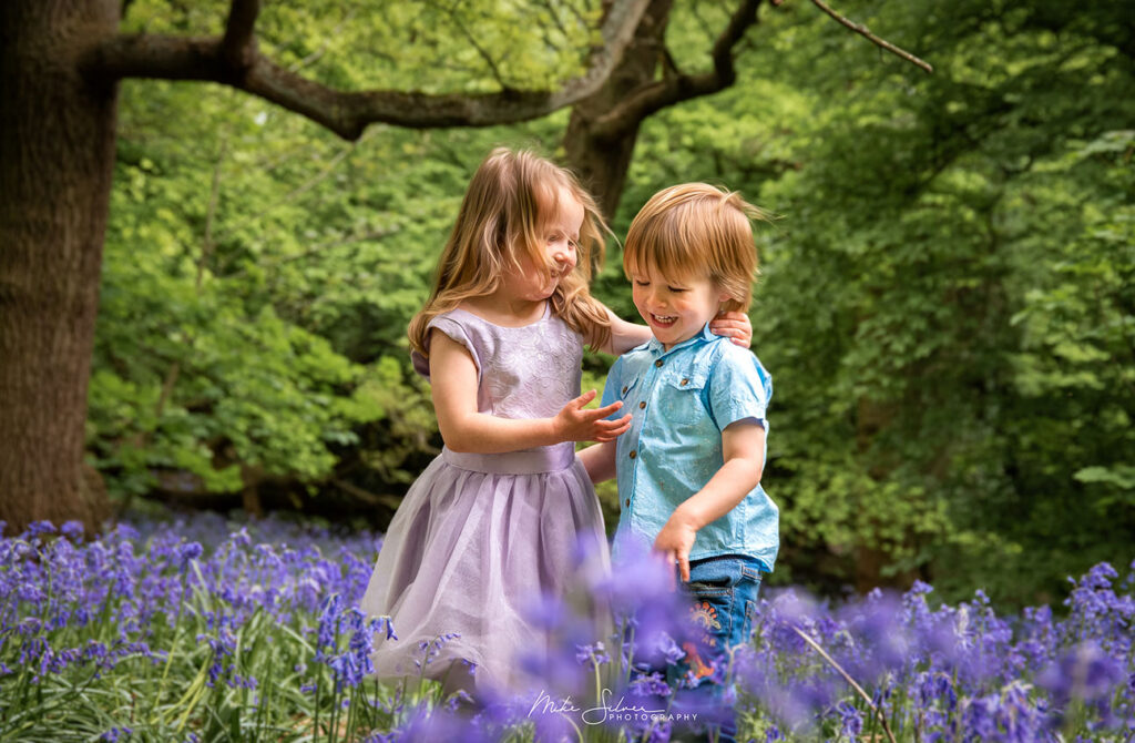 Children playing in Bluebell woodland